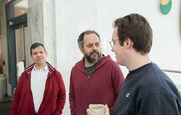 Three IT staff members